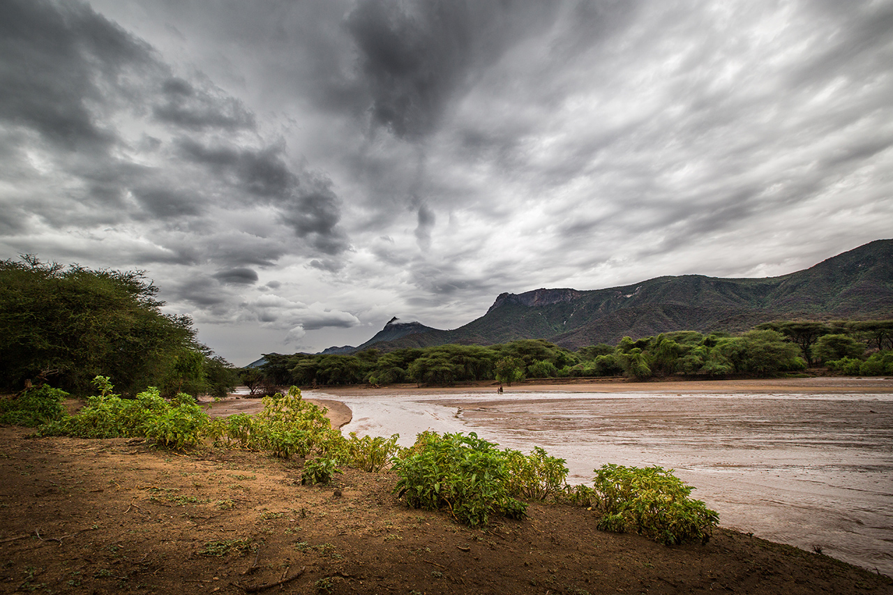 The day before, this river was as dry as a desert. A huge rain storm flooded the area, and at one point it looked like tsunami-like rushing waters, making the roads impassable.  