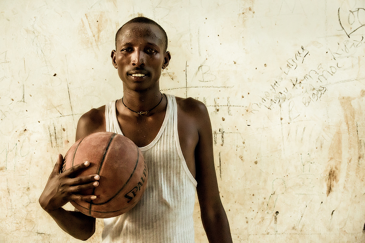 My friend, Jackson Leleshep, after an intense game of basketball in South Horr, Kenya.  He's Samburu just like the traditional warriors; the only difference being that he received education. 